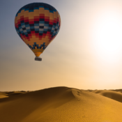 Experience an exclusive hot-air balloon ride over the desert, a highlight of Luxury Morocco Tours, showcasing breathtaking panoramic views and ultimate luxury.