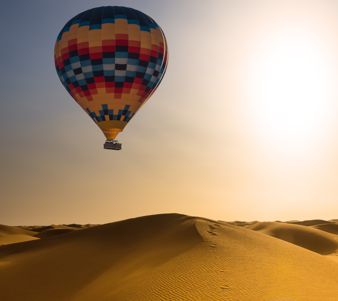 Experience an exclusive hot-air balloon ride over the desert, a highlight of Luxury Morocco Tours, showcasing breathtaking panoramic views and ultimate luxury.
